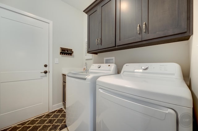 570 Sudbury Cir, Oswego, IL 60543 - laundry area featuring cabinet space, washer and clothes dryer, and baseboards
