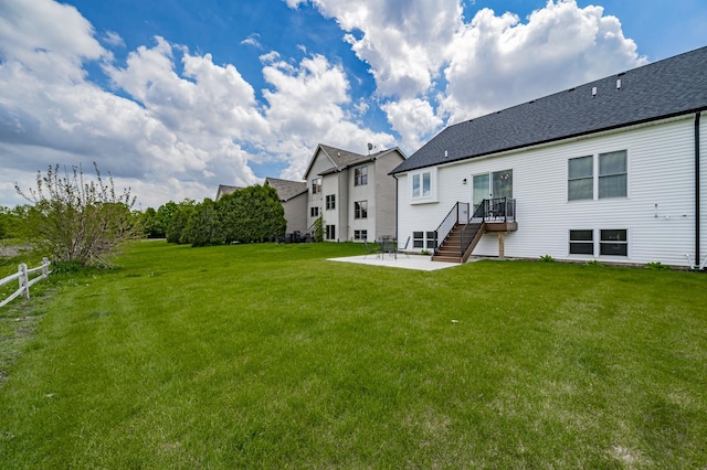 570 Sudbury Cir, Oswego, IL 60543 - back of house featuring a patio area and roof with shingles