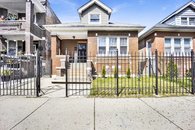 1022 N Lavergne Ave, Chicago, IL 60651 - view of front of property with brick siding, covered porch, a gate, and a fenced front yard