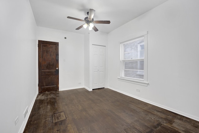 1022 N Lavergne Ave, Chicago, IL 60651 - spare room featuring dark wood finished floors, a ceiling fan, and baseboards