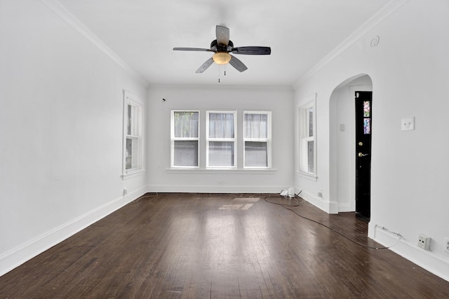 1022 N Lavergne Ave, Chicago, IL 60651 - empty room featuring arched walkways, a ceiling fan, ornamental molding, wood finished floors, and baseboards