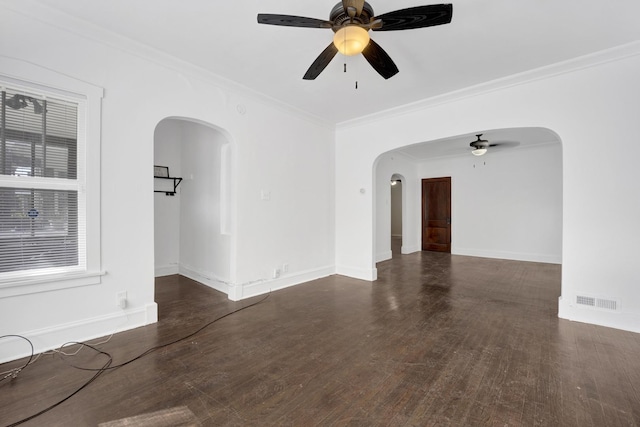 1022 N Lavergne Ave, Chicago, IL 60651 - spare room with a ceiling fan, arched walkways, crown molding, wood finished floors, and baseboards