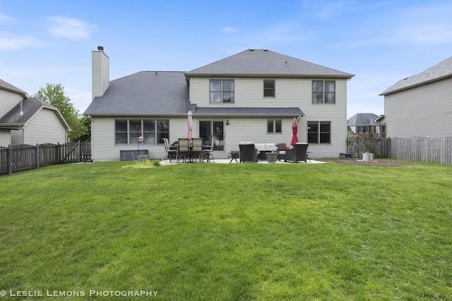 back of house featuring outdoor lounge area, a chimney, a patio, and roof with shingles
