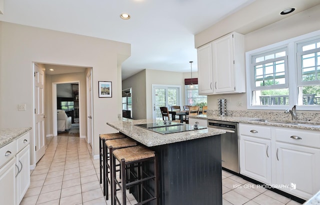 36708 Old Woods Trl, Gurnee, IL 60031 - kitchen featuring dishwasher, black electric cooktop, a kitchen island, light tile patterned floors, and healthy amount of natural light
