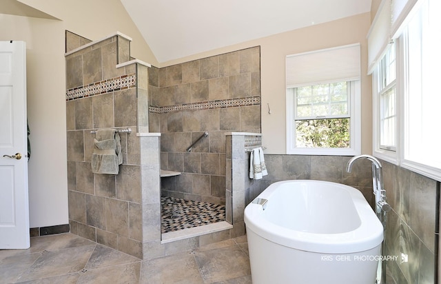36708 Old Woods Trl, Gurnee, IL 60031 - bathroom with a freestanding tub, a walk in shower, tile walls, and lofted ceiling