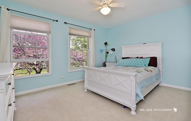 36708 Old Woods Trl, Gurnee, IL 60031 - bedroom featuring light carpet, baseboards, and ceiling fan