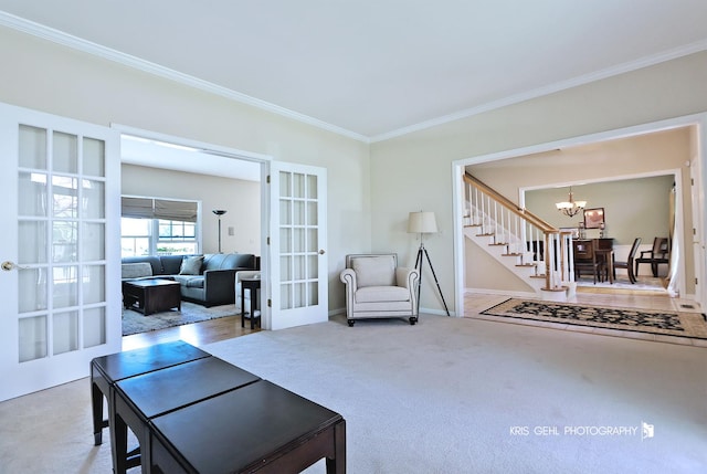 36708 Old Woods Trl, Gurnee, IL 60031 - living area with french doors, a chandelier, ornamental molding, and carpet