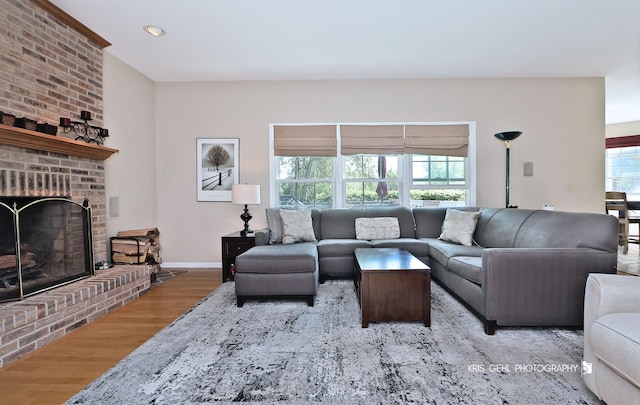 36708 Old Woods Trl, Gurnee, IL 60031 - living room with wood finished floors, a brick fireplace, and recessed lighting