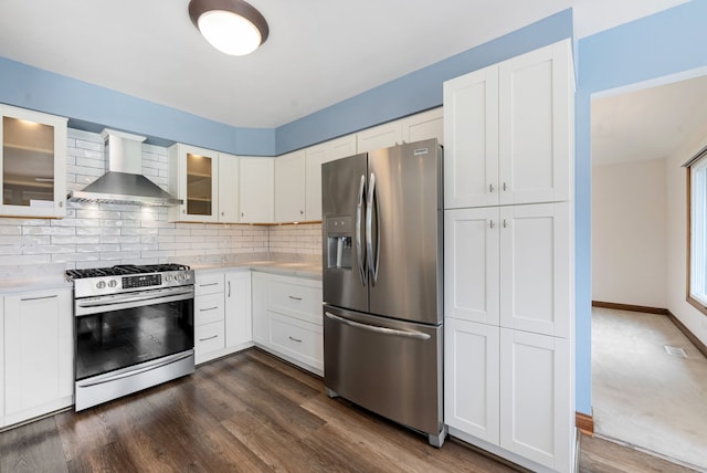 15540 Frances Ln, Orland Park, IL 60462 - kitchen with appliances with stainless steel finishes, wall chimney exhaust hood, light countertops, tasteful backsplash, and dark wood finished floors