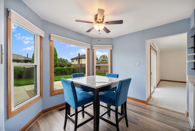 15540 Frances Ln, Orland Park, IL 60462 - dining area with baseboards, light wood-style flooring, and ceiling fan