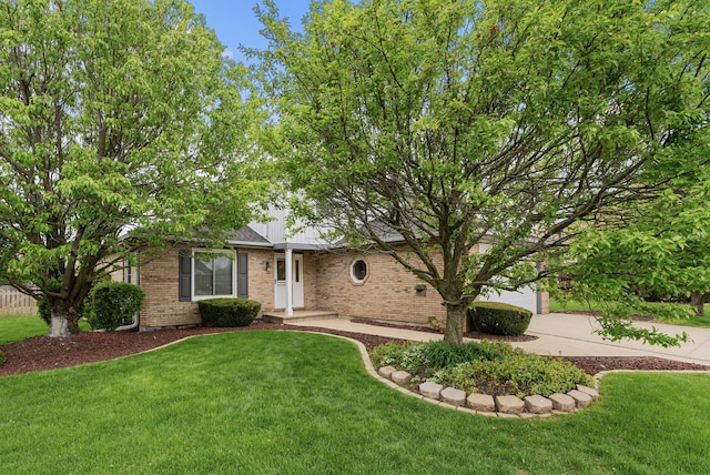 15540 Frances Ln, Orland Park, IL 60462 - view of front facade with brick siding, a front yard, and concrete driveway