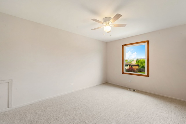 15540 Frances Ln, Orland Park, IL 60462 - spare room featuring light colored carpet, a ceiling fan, and baseboards