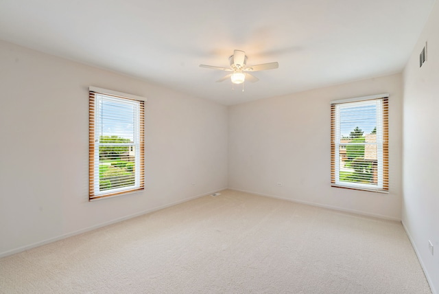 15540 Frances Ln, Orland Park, IL 60462 - empty room with light carpet, ceiling fan, and baseboards