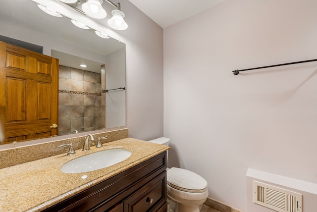 15540 Frances Ln, Orland Park, IL 60462 - bathroom featuring toilet, a tile shower, and vanity