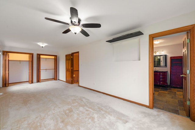 15540 Frances Ln, Orland Park, IL 60462 - unfurnished bedroom featuring carpet floors, baseboards, multiple closets, ceiling fan, and ensuite bathroom