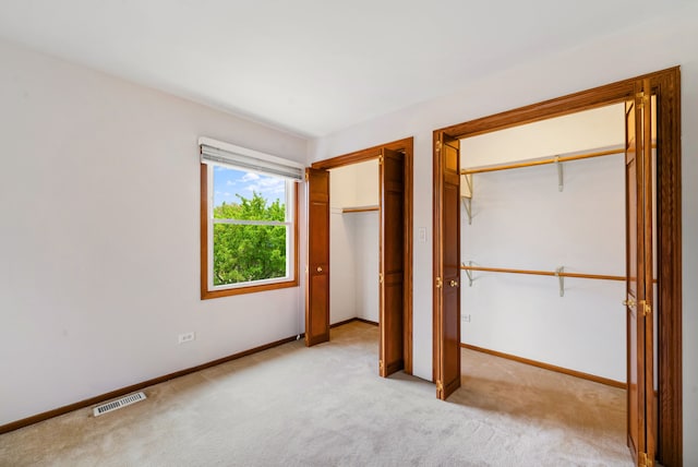 15540 Frances Ln, Orland Park, IL 60462 - unfurnished bedroom featuring multiple closets, carpet flooring, and baseboards