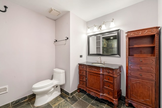 15540 Frances Ln, Orland Park, IL 60462 - full bathroom with baseboards, toilet, vanity, and stone finish flooring