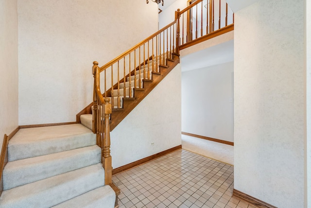 15540 Frances Ln, Orland Park, IL 60462 - stairway featuring baseboards, carpet, and a towering ceiling
