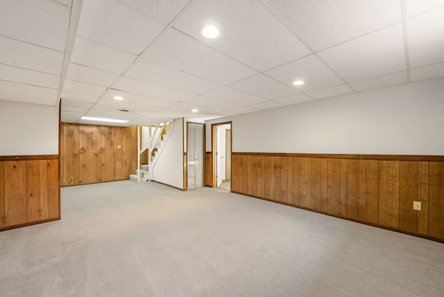 15540 Frances Ln, Orland Park, IL 60462 - finished below grade area with wooden walls, wainscoting, stairs, a drop ceiling, and carpet flooring
