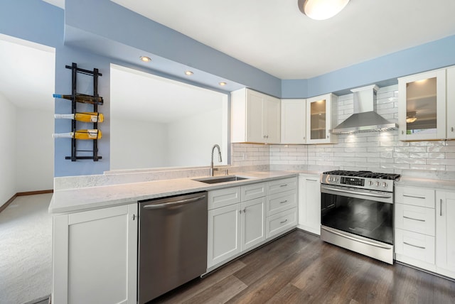 15540 Frances Ln, Orland Park, IL 60462 - kitchen with appliances with stainless steel finishes, a sink, wall chimney exhaust hood, backsplash, and white cabinets