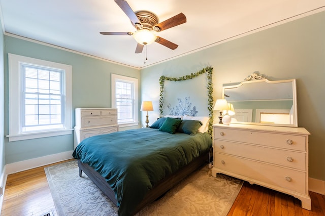 1521 W University Ave, Champaign, IL 61821 - bedroom featuring light wood finished floors, ornamental molding, baseboards, and a ceiling fan