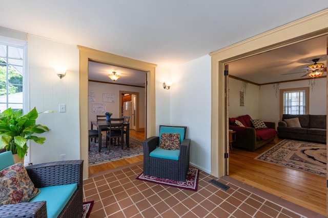 1521 W University Ave, Champaign, IL 61821 - living area featuring dark wood finished floors and a ceiling fan