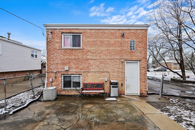 14821 Cooper Ave, Harvey, IL 60426 - back of house with central AC, brick siding, and a fenced backyard