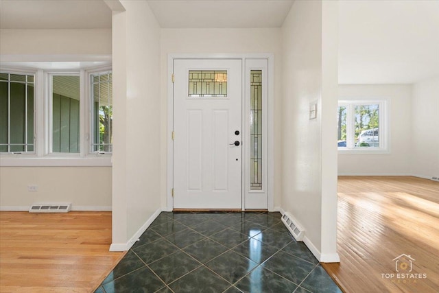 919 Santa Rosa Ave, Wheaton, IL 60187 - foyer entrance featuring baseboards and dark tile patterned flooring