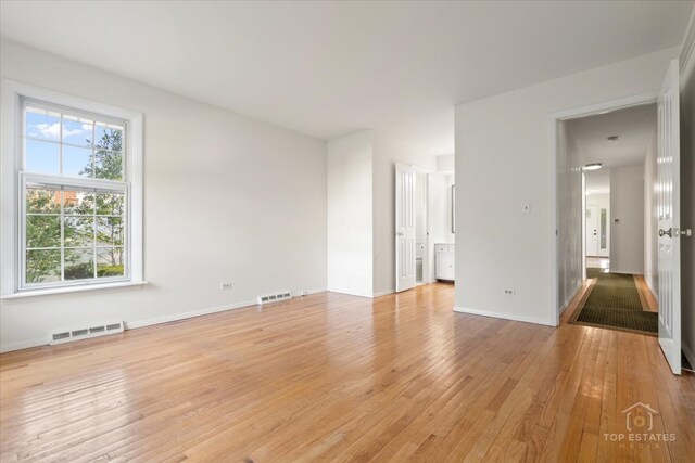 919 Santa Rosa Ave, Wheaton, IL 60187 - spare room featuring light wood finished floors and baseboards