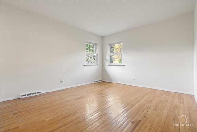 919 Santa Rosa Ave, Wheaton, IL 60187 - spare room featuring baseboards and light wood-style floors