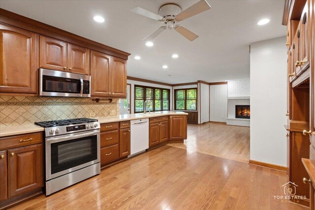 919 Santa Rosa Ave, Wheaton, IL 60187 - kitchen featuring appliances with stainless steel finishes, ceiling fan, light countertops, a peninsula, and recessed lighting