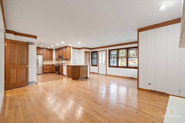 919 Santa Rosa Ave, Wheaton, IL 60187 - unfurnished living room featuring light wood finished floors, baseboards, recessed lighting, and a sink