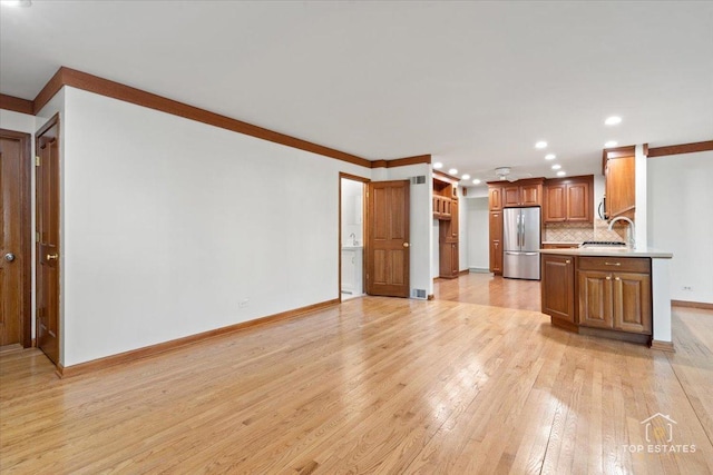 919 Santa Rosa Ave, Wheaton, IL 60187 - kitchen featuring freestanding refrigerator, a sink, light wood-style flooring, light countertops, and recessed lighting