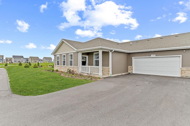 1187 Sonoma Ct, Pingree Grove, IL 60140 - ranch-style home featuring stone siding, driveway, covered porch, and a front lawn