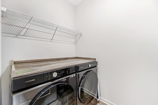 1187 Sonoma Ct, Pingree Grove, IL 60140 - washroom with washer and clothes dryer, baseboards, and wood finished floors