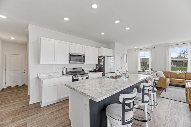 1187 Sonoma Ct, Pingree Grove, IL 60140 - kitchen featuring stainless steel appliances, a sink, light countertops, white cabinetry, and recessed lighting