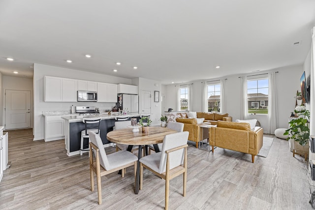 1187 Sonoma Ct, Pingree Grove, IL 60140 - dining space featuring light wood-type flooring, plenty of natural light, and recessed lighting