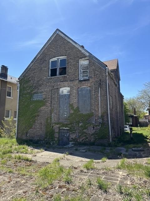 7347 S Paxton Ave, Chicago, IL 60649 - view of side of property featuring brick siding