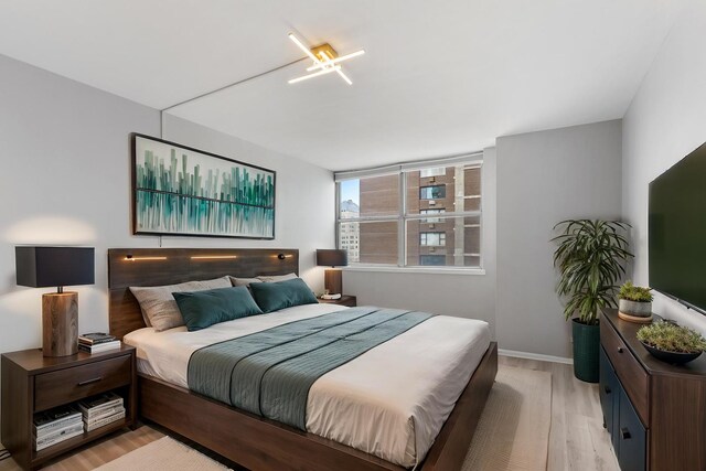 6301 N Sheridan Rd Unit 11D, Chicago, IL 60660 - bedroom featuring light wood-style floors and baseboards