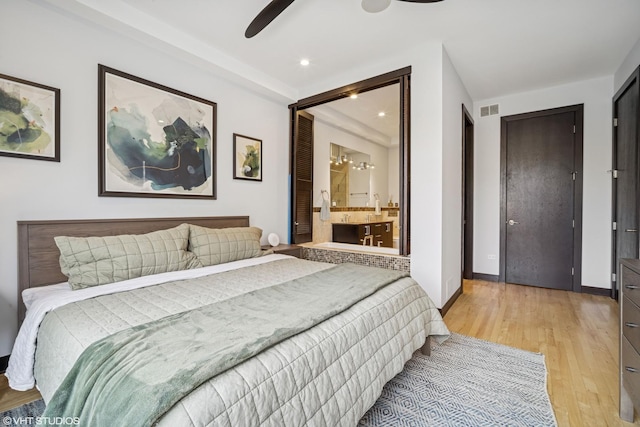 2130 W N Ave Unit 208, Chicago, IL 60647 - bedroom featuring light wood-type flooring, baseboards, recessed lighting, connected bathroom, and a ceiling fan