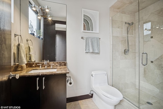 2130 W N Ave Unit 208, Chicago, IL 60647 - full bathroom with baseboards, toilet, a stall shower, and vanity