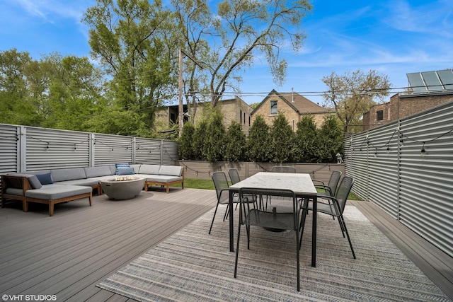 2130 W N Ave Unit 208, Chicago, IL 60647 - deck with an outdoor living space with a fire pit, outdoor dining area, and a fenced backyard