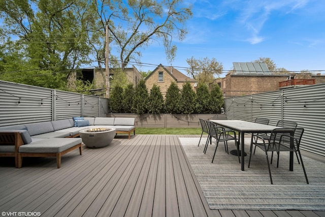 2130 W N Ave Unit 208, Chicago, IL 60647 - deck featuring an outdoor living space with a fire pit, outdoor dining area, and a fenced backyard