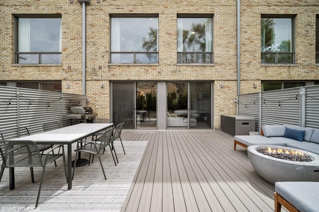 2130 W N Ave Unit 208, Chicago, IL 60647 - deck featuring a fire pit, grilling area, and outdoor dining space