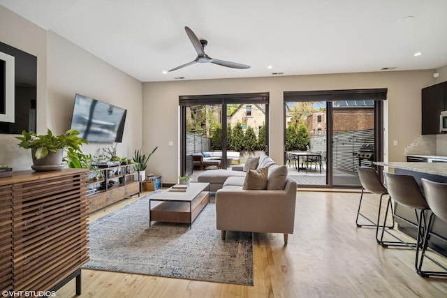 2130 W N Ave Unit 208, Chicago, IL 60647 - living room featuring light wood-type flooring, a ceiling fan, and recessed lighting