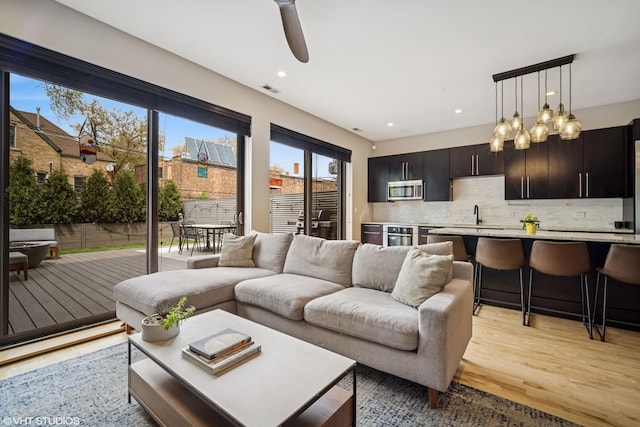 2130 W N Ave Unit 208, Chicago, IL 60647 - living room with light wood-type flooring, ceiling fan, and recessed lighting