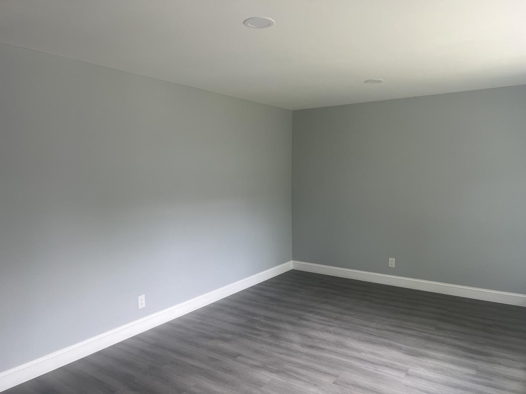 424 N 11th St, Dekalb, IL 60115 - unfurnished room featuring baseboards, dark wood-style floors, and recessed lighting