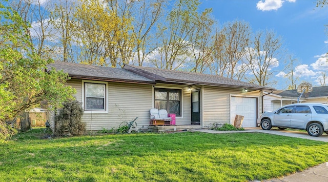 single story home featuring a garage, a front lawn, driveway, and roof with shingles