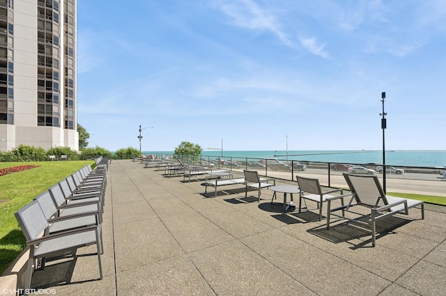 surrounding community featuring a water view