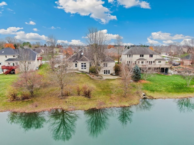 aerial view of residential area featuring a nearby body of water